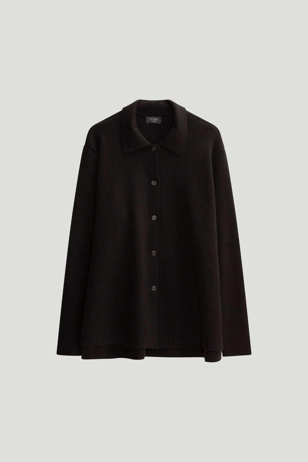black merino wool jacket on a white background
